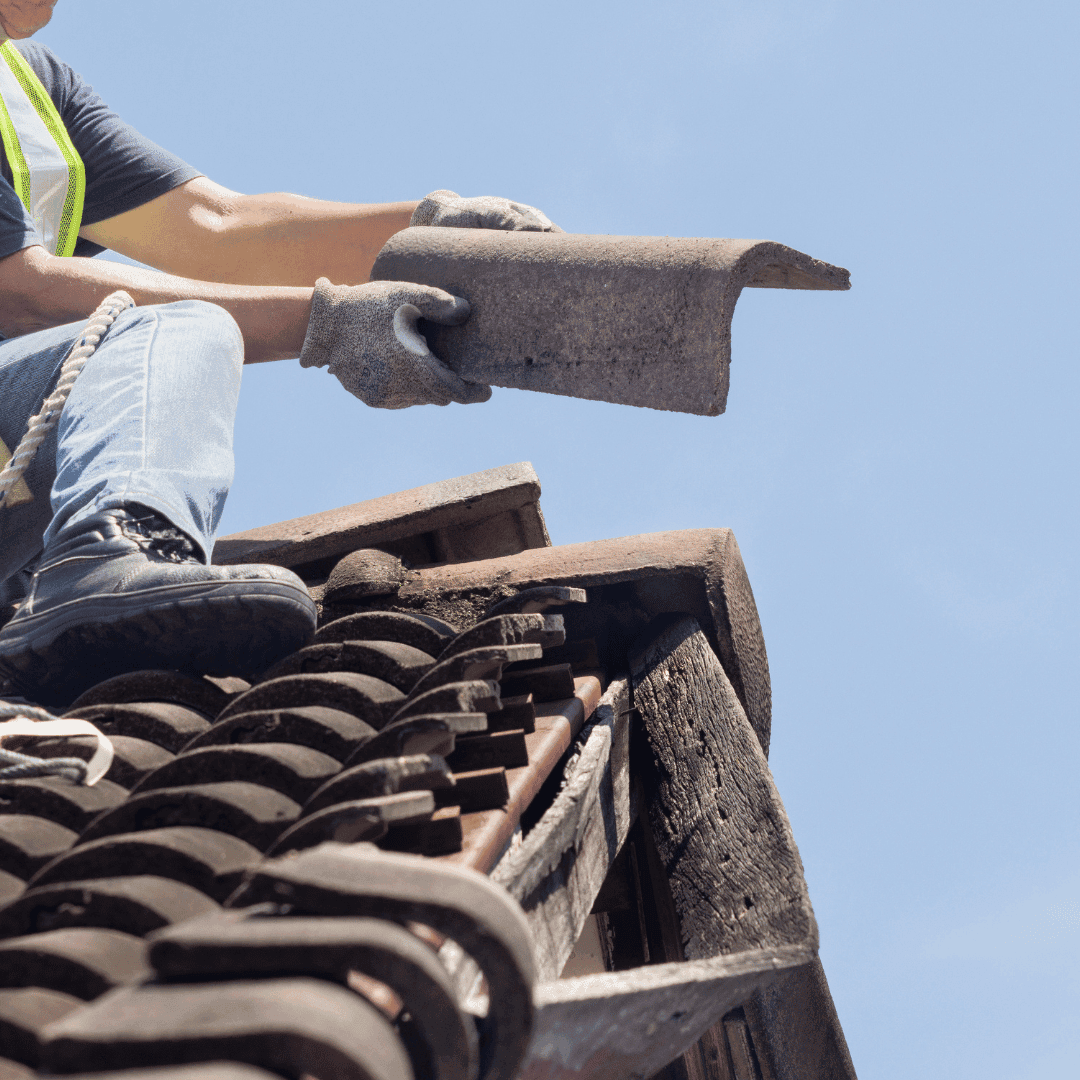 Roofer repairing flashing on a Crewe home