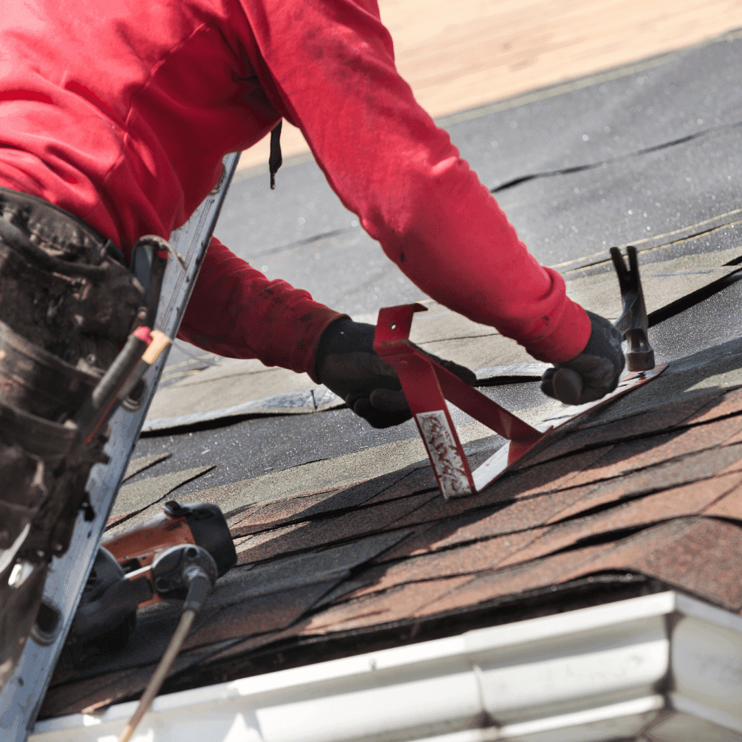 Roofer inspecting damaged roof in Crewe