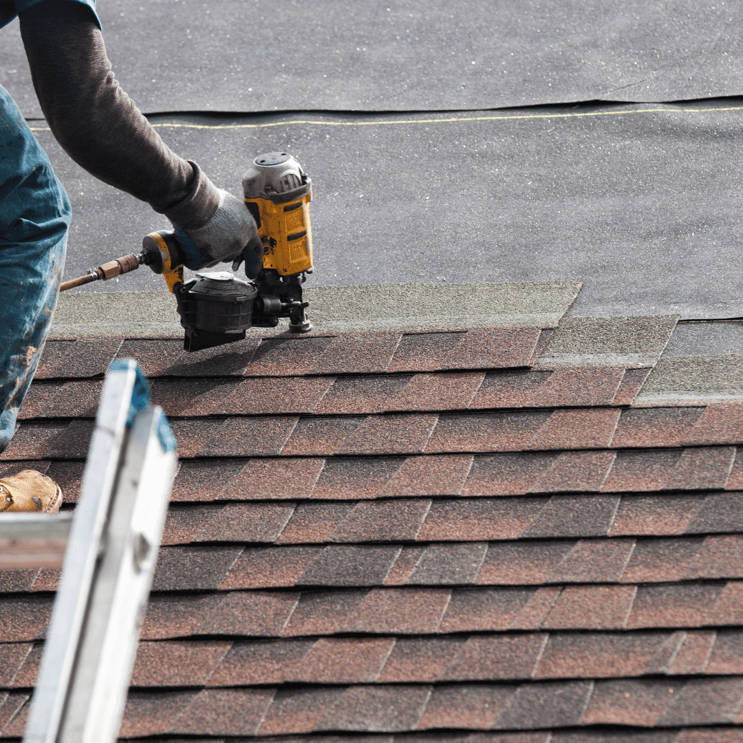Roofer inspecting a roof with potential leaks in Crewe