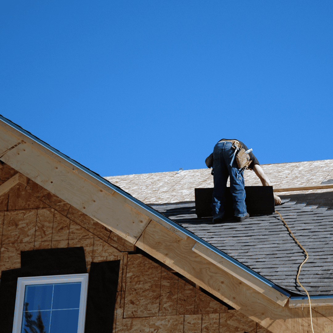 Roofer replacing aging materials on a Crewe property