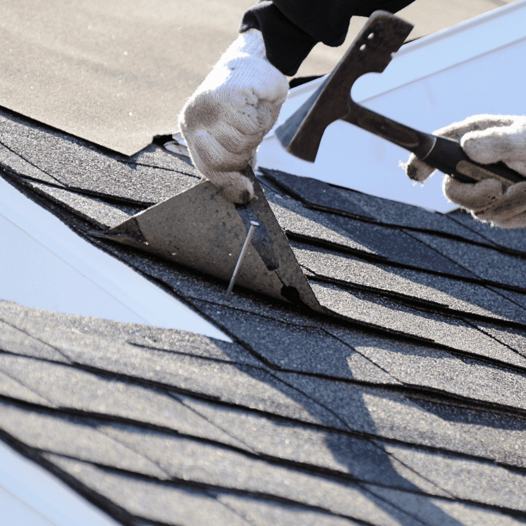 Roofer inspecting damaged guttering on a Crewe home